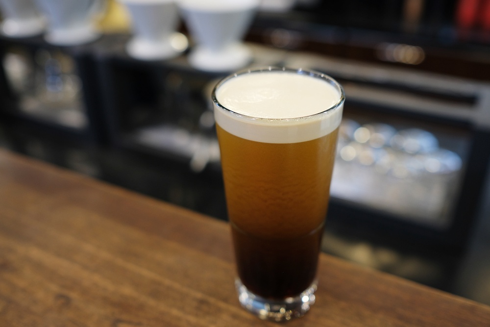 nitrogen home brewed beer poured with thick foam head